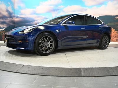 2018 Tesla Model 3 — rear three-quarter view