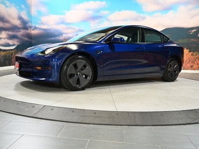 2023 Tesla Model 3 — rear three-quarter view