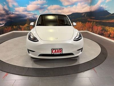 2023 Tesla Model Y — rear three-quarter view