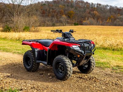 2026 Honda FourTrax Rancher 4x4 TRX420FM1T in Hero Red — front three-quarter view