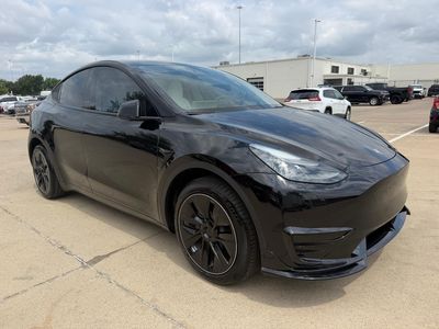 2024 Tesla Model Y — side profile view