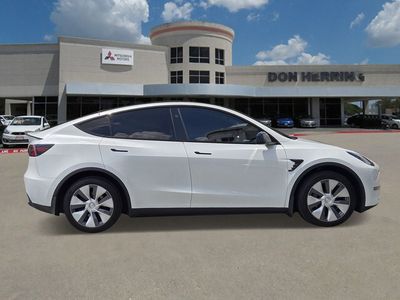 2024 Tesla Model Y — side profile view