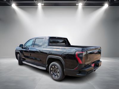 2026 GMC Sierra EV — rear three-quarter view
