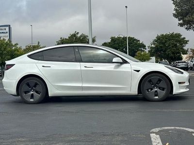 2023 Tesla Model 3 — rear three-quarter view