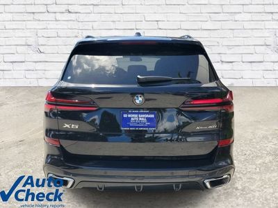 2026 BMW X5 — rear three-quarter view
