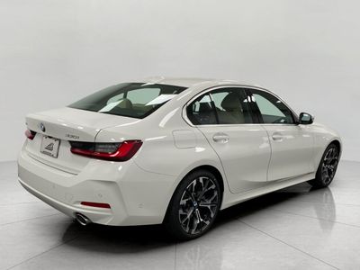 2026 BMW 330i — rear three-quarter view