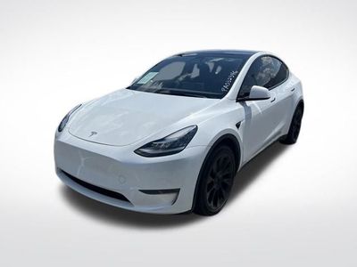 2023 Tesla Model Y — rear three-quarter view
