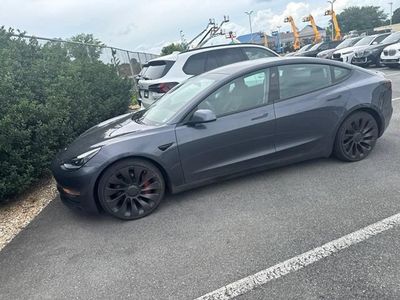 2021 Tesla Model 3 — rear three-quarter view