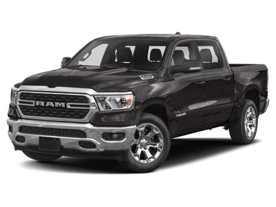 2022 RAM 1500 Big Horn 4x4 Crew Cab 5'7" Box in Granite Crystal Metallic Clearcoat — front three-quarter view