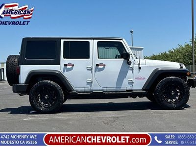 2015 Jeep Wrangler Unlimited — rear three-quarter view