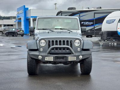 2014 Jeep Wrangler — rear three-quarter view