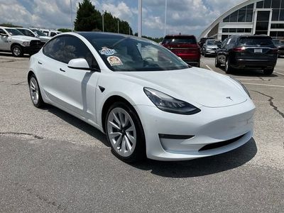 2021 Tesla Model 3 — rear three-quarter view