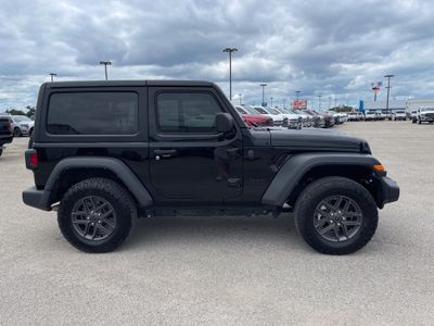 2024 Jeep Wrangler — rear three-quarter view
