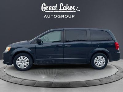 2014 Dodge Grand Caravan — side profile view