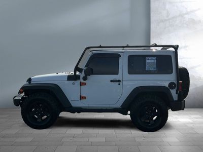 2015 Jeep Wrangler — rear three-quarter view