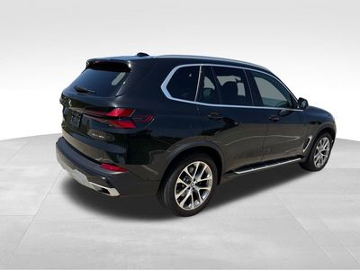 2026 BMW X5 — rear three-quarter view
