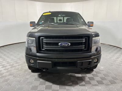 2014 Ford F-150 — rear three-quarter view