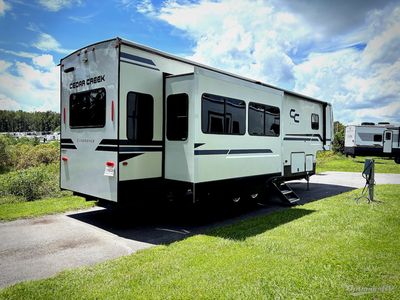 2023 Forest River Cedar Creek Experience — rear three-quarter view