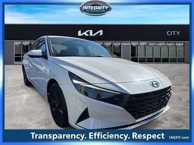 2021 Hyundai Elantra SEL in Quartz White — front three-quarter view