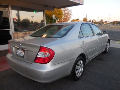 2003 Toyota Camry — rear three-quarter view