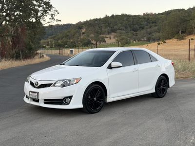 2014 Toyota Camry in White — front three-quarter view