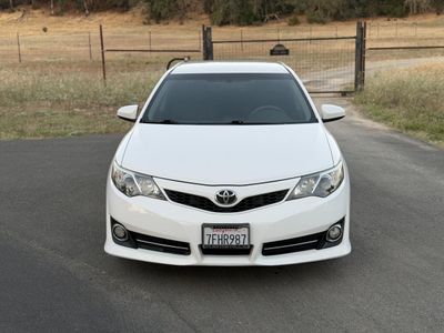 2014 Toyota Camry — rear three-quarter view