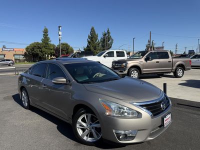 2015 Nissan Altima in Champagne — front three-quarter view