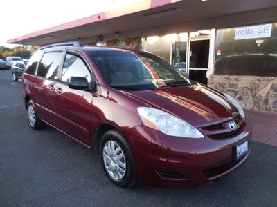 2008 Toyota Sienna in Maroon — front three-quarter view
