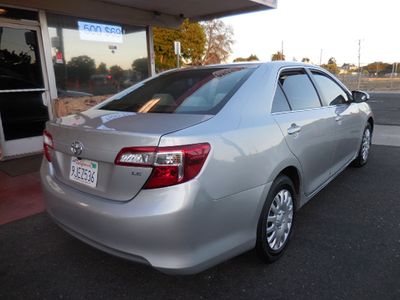 2012 Toyota Camry — rear three-quarter view