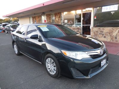 2013 Toyota Camry in Blue — front three-quarter view