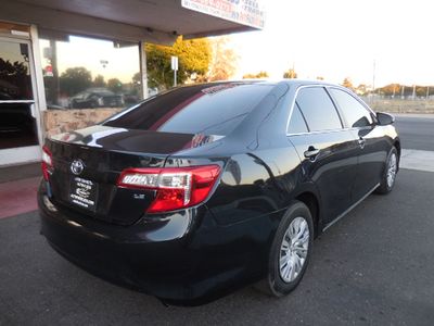 2013 Toyota Camry — rear three-quarter view