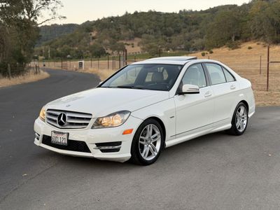 2012 Mercedes-Benz C-Class in White — front three-quarter view
