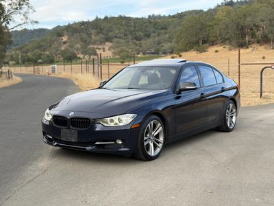 2013 BMW 3 Series in Blue — front three-quarter view