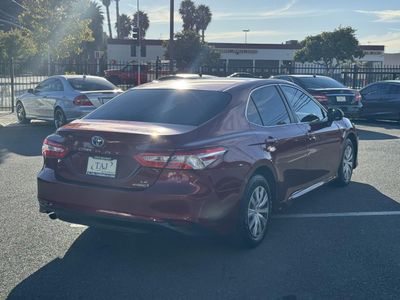 2018 Toyota Camry Hybrid — rear three-quarter view