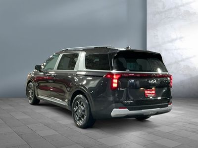 2026 Kia Carnival Hybrid — rear three-quarter view