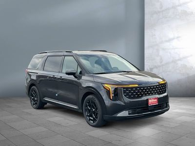 2026 Kia Carnival Hybrid — rear three-quarter view