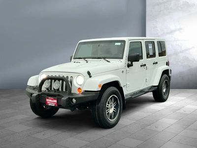 2013 Jeep Wrangler Unlimited — front three-quarter view