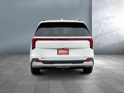 2026 Kia Carnival Hybrid — rear three-quarter view