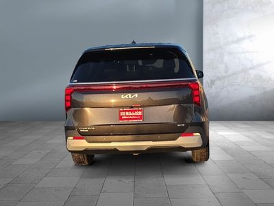 2026 Kia Carnival Hybrid — rear three-quarter view