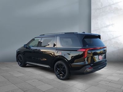 2026 Kia Carnival — rear three-quarter view