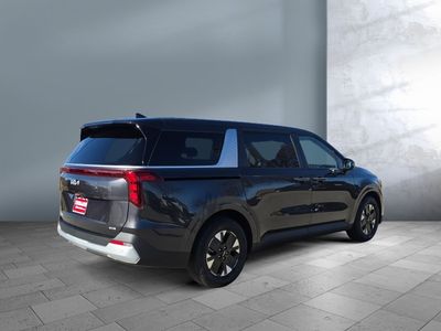 2026 Kia Carnival Hybrid — rear three-quarter view