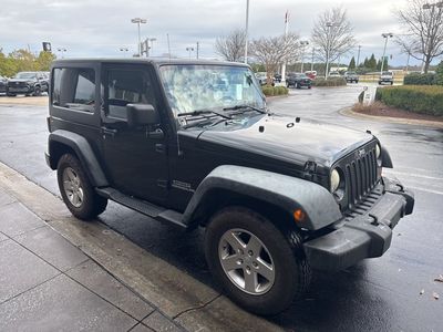 2012 Jeep Wrangler Sport — front three-quarter view