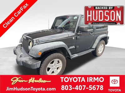 2012 Jeep Wrangler Sport — rear three-quarter view