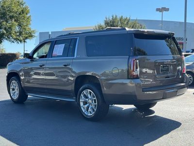 2015 GMC Yukon XL SLT 1500 — rear three-quarter view