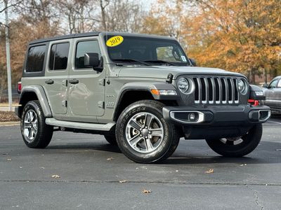 2019 Jeep Wrangler Unlimited Sahara — front three-quarter view