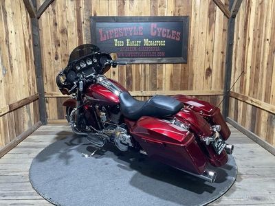 2016 Harley-Davidson Street Glide Special FLHXS in Velocity Red Sunglo — front three-quarter view