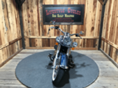 2016 Harley-Davidson Softail Deluxe FLSTN in Cosmic Blue Pearl — front three-quarter view