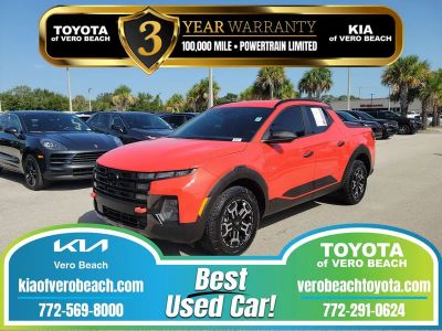 2025 Hyundai Santa Cruz XRT in Canyon Red — front three-quarter view
