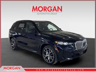 2024 BMW X5 xDrive50e in Black — front three-quarter view