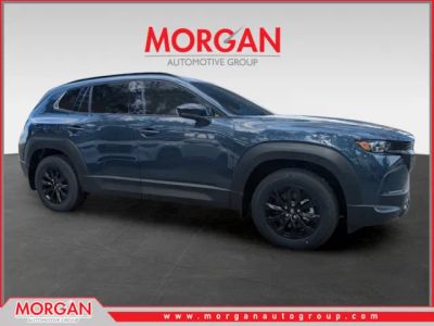 2026 Mazda CX-50 Hybrid Premium in Ingot Blue Metallic — front three-quarter view